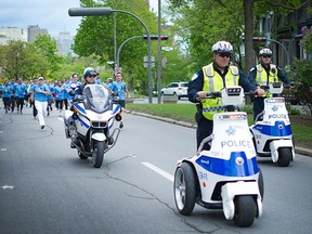 Law enforcement officers raised $13,000 for the Special Olympics during the May Torch Run, pictured here.