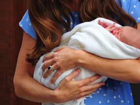 A file picture taken on July 23, 2013, shows Catherine, Duchess of Cambridge, holding her new baby son. Britain's Prince William and his wife Kate have named their new baby boy George Alexander Louis, Kensington Palace announced on Wednesday July 24, 2013. The baby will be known as His Royal Highness Prince George of Cambridge.   AFP PHOTO / CARL COURT/FILESCARL COURT/AFP/Getty Images