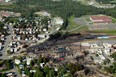 Aerial images provided by the Surete du Quebec show the site where a Montreal, Maine and Atlantic Railway train derailed and exploded in Lac Megantic last
Saturday. Mayors across the country are speaking up in the wake of the disaster, saying they have a right to know what's being transported through their territory. (Surete du Quebec)