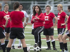 Cathy Lipari, centre, with members of her team at John Abbott during a practice.