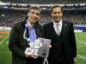 The late Tony Proudfoot, seen here receiving the Hugh Campbell Distinguished Leadership Award in 2010 from CFL commissioner Mark Cohon.
John Mahoney/The Gazette