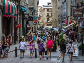 Tourists in Old Port in Montreal on Tuesday, July 30, 2013. Local tourism is down slightly, according to figures compiled by Montreal's association of hotels. But that drop is more worrisome because of a hope that more visitors would return to the city this summer in the wake of last year's student protests. (Dario Ayala / THE GAZETTE)