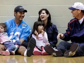 Montreal Alouettes head coach Marc Trestman gets quarterback Anthony Calvillo and his wife Alexia laughing during the first day of the 2010 training camp at Bishop's University. Daughters Athena (left) and Olivia also attend. Could there be a big reunion in Chicago one of these days? (Photo by John Mahoney, The Gazette)