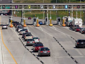 Cars line up to pay the toll on Highway 30.