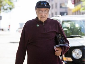 Jean-Claude Corbeil exits the Montreal Courthouse after pleading guilty to charges of possession of child pornography on Tuesday, Aug. 6, 2013.