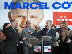 In this photo from July 3, Marcel Cote announces his candidacy for the mayoralty of Montreal in Montreal. Cote stood surrounded by friends and political allies, but does that still matter in an age where most friends are found on Facebook?  (Justin Tang / THE GAZETTE)