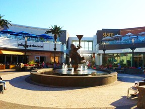 Fountains and palm trees create the Miami-like vibe of the Dix30 lifestyle village.