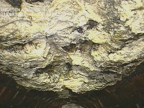 This undated image released by Thames Water company, shows part of a 13-tonne lump of fat and other debris coagulated inside a main London city sewer. The utility company says it has cleared what it calls the biggest "fatberg" ever recorded in Britain, a blob of congealed fat and baby wipes the size of a bus, which was lodged inside a London sewer drain. (AP Photo/Thames Water)