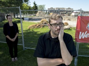 MONTREAL, QUE.: AUGUST 17, 2013-- Comedian T.J. Hazelden and his wife Chantel Gallant mourn the closing and demolition of the Wendy's at de Salaberry Boulevard and Sources Boulevard in Dollard des
Ormeaux in Montreal on Saturday, August 17, 2013. Hazelden, who hosts the web series Dinner With TJ, has selective eating disorder will be hosting a funeral for the old Wendy's on Aug. 24, 2013. (Justin Tang / THE GAZETTE)