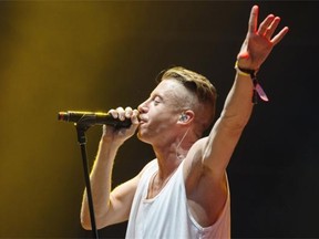 Macklemore performs at Osheaga 2013, on Saturday, Aug. 3.
