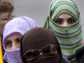 In 2010, women take part in a protest against a  Quebec law that would have banned veils and other facial coverings for those expecting or dispensing provincial government services.