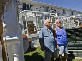 Gerard Labelle, left, and his wife Margaret Dare-Labelle's shed and back wall were damaged in the Jul. 16 blaze.