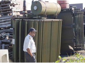 Security guard patrols yard at Reliance site.