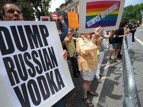 Protesters held a demonstration yesterday against Russian anti-gay legislation and against Russian President Vladimir Putin stands on gay rights, in front of the Russian Consulate in New York. Protesters called for a boycott of Russian products and ask the Russian government to repeal the anti-gay propaganda law before the 2014 Winter Olympics in Sochi. However Russia's minister of sport today reiterated that the law will be enforced and enforced during next year's games. AFP PHOTO/Emmanuel DunandEMMANUEL DUNAND/AFP/Getty Images