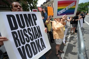 As protests continue against Russian legislation that targets gays, Canadian Foreign Minister John Baird says the international furor should allow the world to put the regime of Vladimir Putin under a microscope. But he notes that Canada has no plans to boycott next year's Winter Olympics in Sochi. AFP PHOTO/Emmanuel DunandEMMANUEL DUNAND/AFP/Getty Images