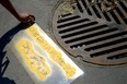 Stencil was used to paint the fish icons on the street.