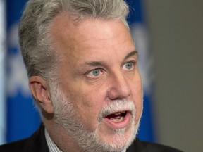 One day after thousands of Montrealers took to the streets to protest against the proposed charter, Quebec Liberal Leader Philippe Couillard warned the Parti Québécois government it would have to adopt a ban on religious symbols in the civil service  "over my dead body." Couillard is welcoming women who wear a Muslim veil into his own party.THE CANADIAN PRESS/Jacques Boissinot