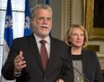 Quebec Liberal Leader Philippe Couillard announces his party's views over the new charter of Quebec values as Liberal MNA Christine St-Pierre, right, looks on. The Liberals believe the provincial government should be a secular institution, but don't think the PQ's proposed ban on religious symbols is the way to do it. THE CANADIAN PRESS/Jacques Boissinot