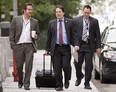 Bernard Drainville, Quenbec minister responsible for Democratic Institutions and Active Citizenship, flanked by press attache Manuel Dionne, left, and a member of his staff walk to a cabinet meeting last week. Drainville is expected to unveil a new Charter of Quebec Values tomorrow. THE CANADIAN PRESS/Jacques Boissinot