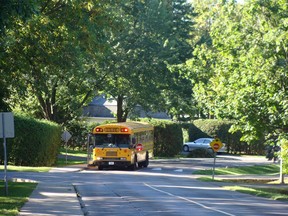 School bus with flashing lights waiting for kids to get in.