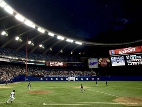 EDITORS NOTE: This images his for reference only. Actual image to be used is saved to Solo as psd file.

MONTREAL, Sept 29/04--As the pop-up fly ball (seen just above the left hand side of the lights) reaches his apex inside the Olympic stadium, Montreal Expos Terrmel Sledge runs towards first base. The caught ball by Florida Marlins third baseman Mike Mordecai put an end to the Expos and Major League baseball in Montreal, Wednesday evening.  (Gazette-Pierre Obendrauf)  SPORTS