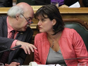 City of Montreal interim mayor Laurent Blanchard (left) speaks with Josée Duplessis, chair of the executive committee during last month's city council meeting. Duplessis today announced her decision to leave politics. (John Kenney / THE GAZETTE)