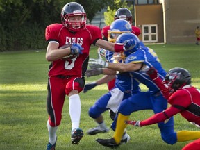 Aiden McMullen carries the ball for Lindsay Place during game against College de Montreal on Sept. 6.