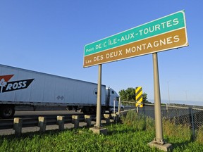 A truck crosses the west bound Ile-Aux-Tourtes bridge into Vaudreuil-Dorion from Sainte-Anne-de-Bellevue.