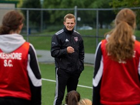 Olivier Prud'Homme, head coach of the Lakeshore AAA girls U17 speaks with his players.