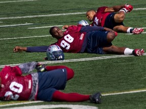 Als' cornerback Byron Parker (20) hopes he'll be able to stretch like this before Sunday's game at Vancouver.
Allen McInnis/The Gazette