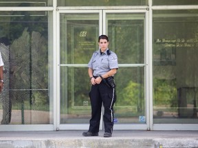 Security officer outside the Reliance office.