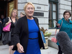 Quebec Premier Pauline Marois walks out of a cabinet meeting Wednesday, September 4, 2013 at the legislature in Quebec City. Marois was elected one year ago on Sept. 4, 2012. THE CANADIAN PRESS/Jacques Boissinot
