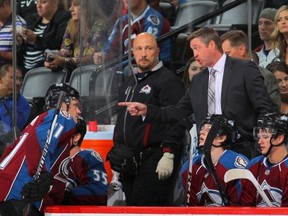 DENVER, CO - SEPTEMBER 18:  Head coach Patrick Roy of the Colorado Avalanche directs Jamie McGinn #11 of the Colorado Avalanche and the team against the Anaheim Ducks during preseason action at Pepsi Center on September 18, 2013 in Denver, Colorado.  (Photo by Doug Pensinger/Getty Images)