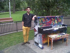 NDG artist Julian Cargnello stands next to repainted public piano that was burnt and damaged by vandals in Parc Notre-Dame-De-Grace on Girouard Street on Sept. 12 (Photo courtesy Julian Cargnello)