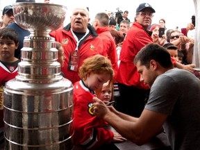 MONTREAL, QUE.: SEPTEMBER 2, 2013--Chateauguay native and Chicago Blackhawks goalie Corey Crawford greets fans and signs autographs as he visits his former home town in Montreal on Monday September 2, 2013. (Allen McInnis / THE GAZETTE)