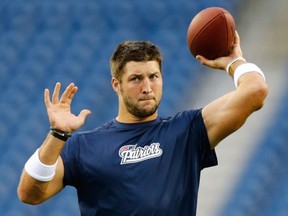 FOXBORO, MA - AUGUST 29: Tim Tebow #5 of the New England Patriots warms up prior to the preseason game against the New York Giants at Gillette Stadium on August 29, 2013 in Foxboro, Massachusetts. (Photo by Jared Wickerham/Getty Images)