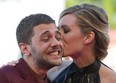 Actress Evelyne Brochu, right, kisses director Xavier Dolan as they arrive for the screening of the movie 'Tom at the Farm' at the 70th edition of the Venice Film Festival Monday, Sept. 2, 2013. (AP Photo/Andrew Medichini)