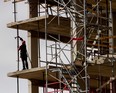 Construction workers build new condos at the Le Canal Griffintown site in the Griffintown area of Montreal on Tuesday October 15, 2013. (Allen McInnis / THE GAZETTE)