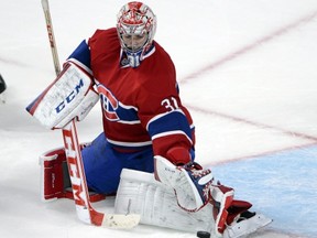 Montreal Canadiens goaltender Carey Price makes a save during third period NHL pre-season action against the Ottawa Senators in Montreal on Thursday, September 26, 2013. THE CANADIAN PRESS/Ryan Remiorz