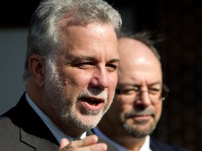 Quebec Liberal leader Philippe Couillard, left, and Jacques Cartier MNA Geoffrey Kelley speak to the media in Pointe Claire on Thursday, Oct. 17, 2013.