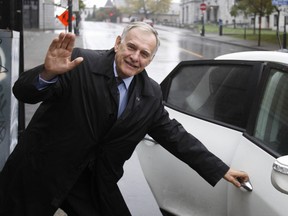 Mayoral candidate Marcel Cote leaves a press conference  in Montreal, on Monday, October 14, 2013 after saying his party plans to cap property taxes to the rate of inflation.