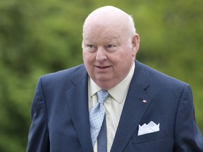 Senator Mike Duffy arrives on Parliament Hill in Ottawa on Thursday. May 23, 2013. A Conservative proposal to suspend three senators without pay and benefits is sparking a passionate debate inside the upper chamber over the powers and independence of Parliament and just how to far go in exercising them. And that debate is expected to become even more passionate in the wake of allegations concerning the PMO made today by Duffy's lawyer. THE CANADIAN PRESS/Adrian Wyld