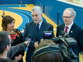 Quebec premier Phillipe Couillard with Soulanges MNA Lucie Charlebois and former Vaudreuil MNA Yvon Marcoux, during a visit to Vaudreuil-Dorion in Oct. 2013.