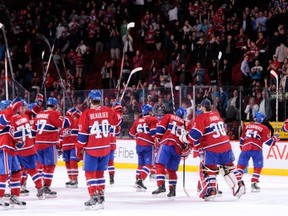 MONTREAL, QC - SEPTEMBER 26:  Members of the Montreal Canadiens acknowledge the fans after defeating the Ottawa Senators in an NHL preseason game at the Bell Centre on September 26, 2013 in Montreal, Quebec, Canada. The Canadiens defeated the Senators 3-1.  (Photo by Richard Wolowicz/Getty Images)
