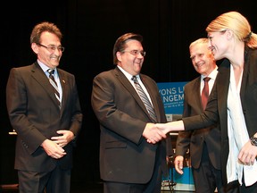 It was all smiles as Mélanie Joly shook  hands with Denis Coderre, while Richard Bergeron, far left, and Marcel Cote looked on prior to the first Montreal mayoralty debate last August. But as voting day nears, has the tone of this campaign turned nasty? (Pierre Obendrauf / THE GAZETTE)