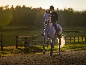 Arianne France rides her horse, Callie in St Lazare Monday, October 7, 2013.