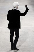 German fashion icon Karl Lagerfeld waves to the crowd after a Chanel show in Paris on Oct. 1.