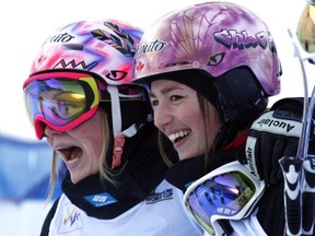 Justine Dufour-Lapointe, left, from Montreal, Que., celebrates her win with her sister and second place finisher Chloe Dufour-Lapointe, from Montreal, Que., during the women's World Cup freestyle ski moguls event in Calgary, Alta., Saturday, Jan. 26, 2013.THE CANADIAN PRESS/Jeff McIntosh