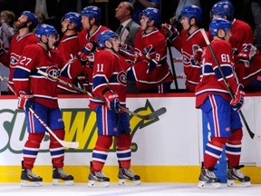 MONTREAL, QC - OCTOBER 5:  Brendan Gallagher #11 of the Montreal Canadiens celebrates his third period goal with teammates during the NHL game against the Philadelphia Flyers at the Bell Centre on October 5, 2013 in Montreal, Quebec, Canada.  The Canadiens defeated the Flyers 4-1.  (Photo by Richard Wolowicz/Getty Images)