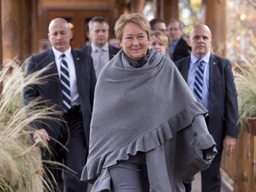 Quebec Premier Pauline Marois leaves after she announced her government will not launch a general election following a special cabinet meeting, Saturday, October 26, 2013 in Saint-Michel-des-Saints Que. Should Quebecers ready themselves for a long political winter? Or is a fall vote still possible? THE CANADIAN PRESS/Jacques Boissinot